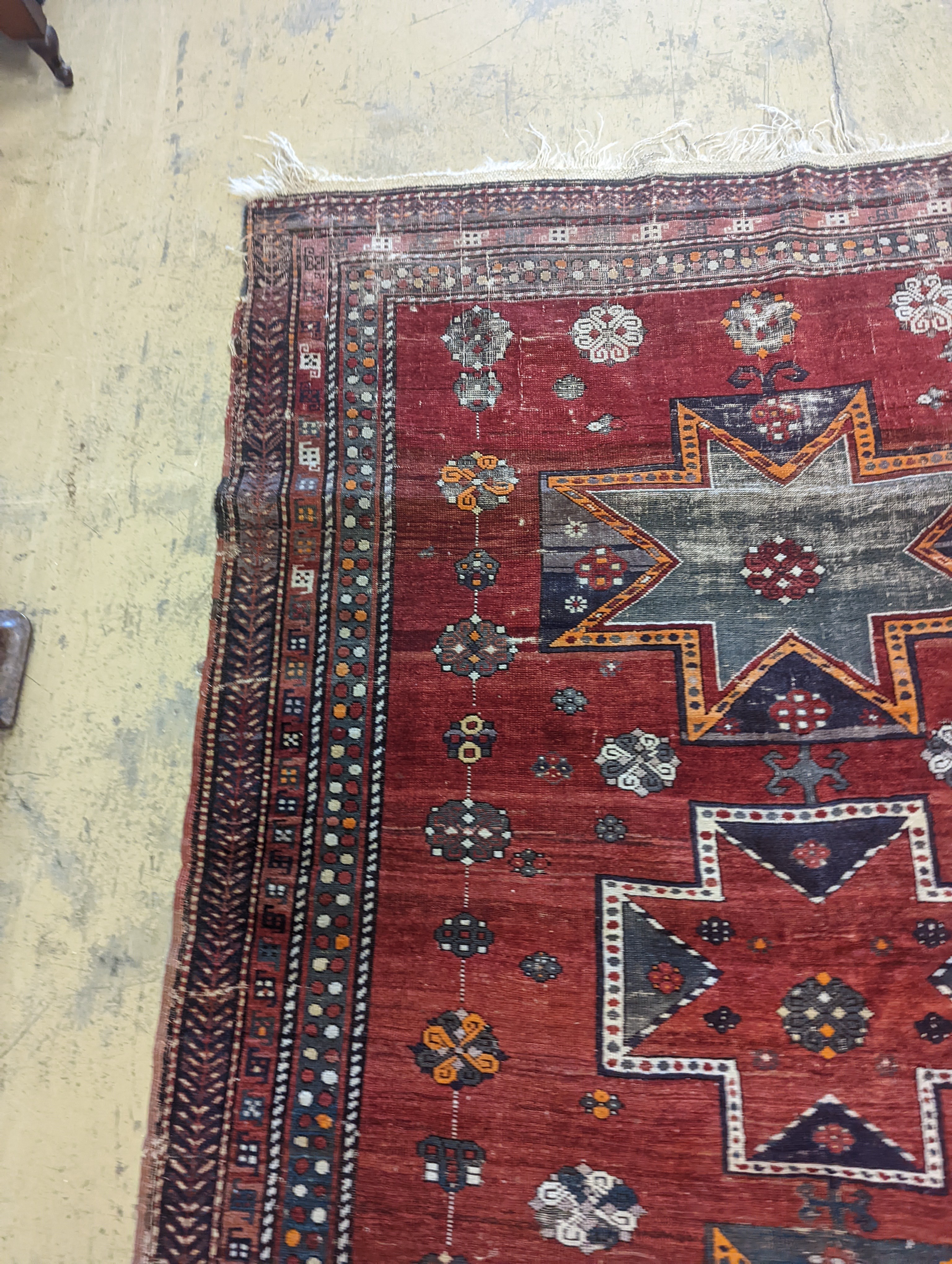 A Kazak red ground rug, 210 x 160cm